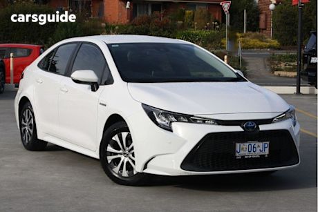 White 2021 Toyota Corolla Sedan ASCENT SPORT HYBRID F