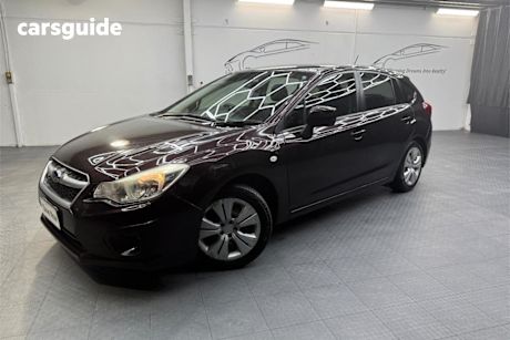 Red 2013 Subaru Impreza Hatchback 2.0I (awd)