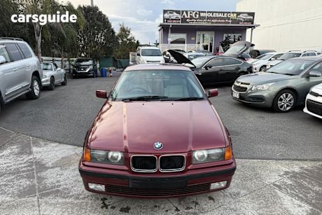 Red 1996 BMW 323I Sedan