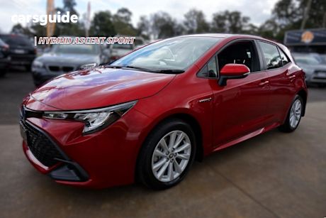 Red 2023 Toyota Corolla Hatchback Ascent Sport Hybrid