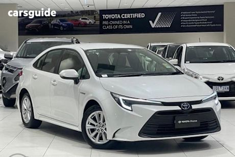 White 2024 Toyota Corolla Sedan ASCENT SPORT HYBRID F