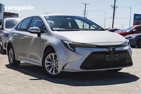 White 2023 Toyota Corolla Sedan ASCENT SPORT HYBRID F