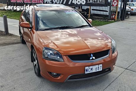 Orange 2007 Mitsubishi 380 Sedan Vr-X