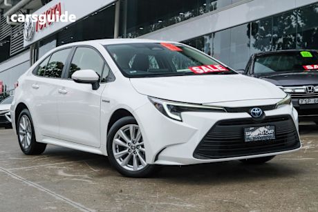 White 2023 Toyota Corolla Sedan ASCENT SPORT HYBRID F