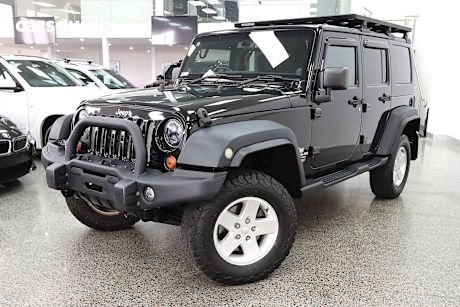 Black 2013 Jeep Wrangler Sedan UNLIMITED SPORT 4X4