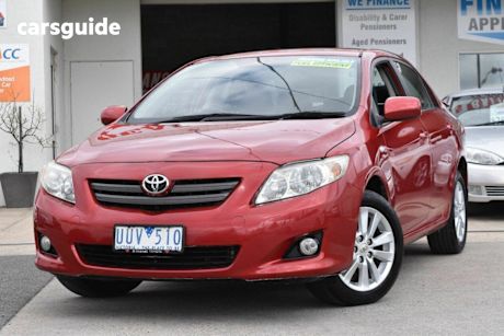 Red 2007 Toyota Corolla Sedan Conquest