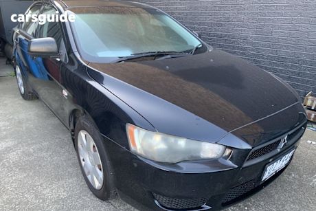 Black 2011 Mitsubishi Lancer Sedan ES F