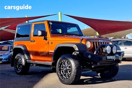 Orange 2011 Jeep Wrangler Softtop Sport (4X4)