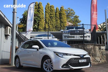 White 2023 Toyota Corolla Hatchback Ascent Sport Hybrid