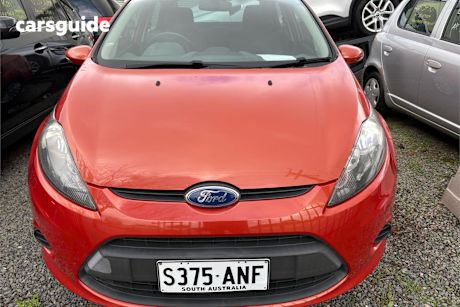 Orange 2011 Ford Fiesta Sedan LX F