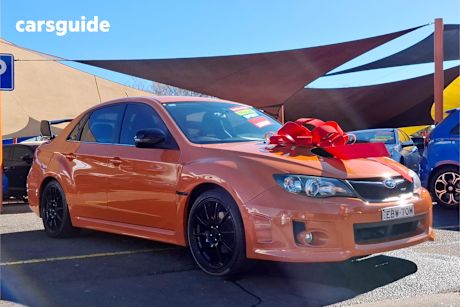 Orange 2012 Subaru Impreza Sedan 2.0I (Awd)