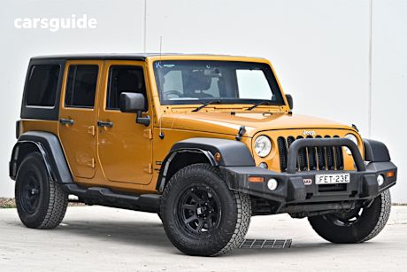Orange 2014 Jeep Wrangler Sedan UNLIMITED SPORT 4X4