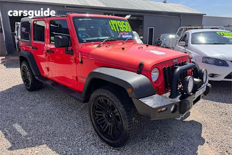 Red 2013 Jeep Wrangler Softtop Unlimited Sport (4X4)