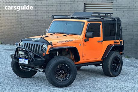 Orange 2012 Jeep Wrangler Sedan SPORT 4X4