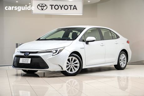 White 2023 Toyota Corolla Sedan ASCENT SPORT HYBRID F