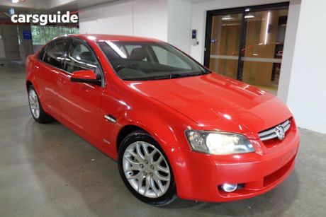 Red 2010 Holden Commodore Sedan International