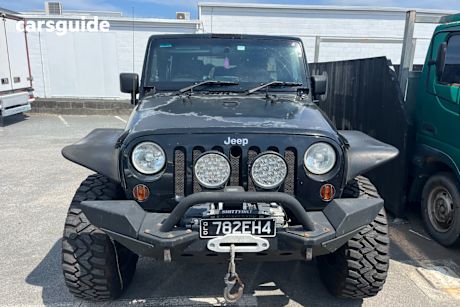 Black 2010 Jeep Wrangler Softtop Unlimited Sport (4X4)
