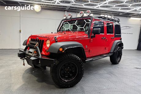 Red 2014 Jeep Wrangler Sedan UNLIMITED SPORT 4X4