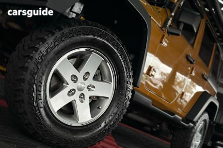 Gold 2014 Jeep Wrangler Sedan UNLIMITED SPORT 4X4