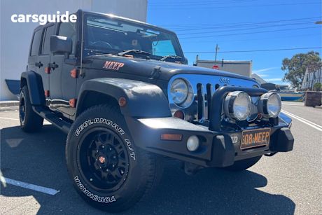 Black 2009 Jeep Wrangler Softtop Unlimited Sport (4X4)