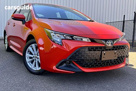 Orange 2024 Toyota Corolla Hatchback Ascent Sport Hybrid