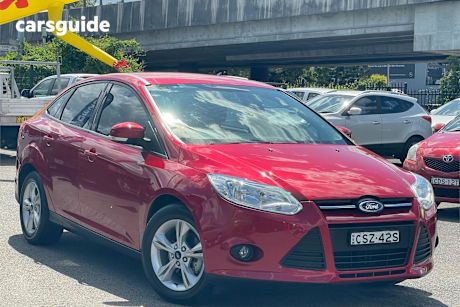 Red 2014 Ford Focus Sedan Trend