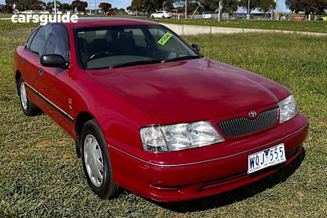 Red 2000 Toyota Avalon Sedan Conquest
