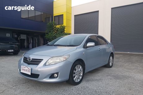 Turquoise 2009 Toyota Corolla Sedan Conquest