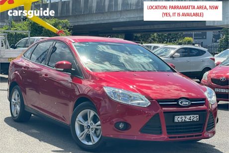 Red 2014 Ford Focus Sedan Trend