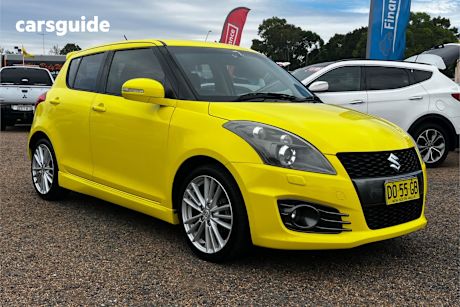 Yellow 2013 Suzuki Swift Hatchback Sport