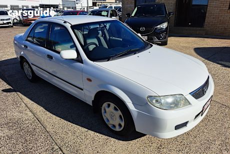 White 2002 Mazda 323 Sedan Protege Shades