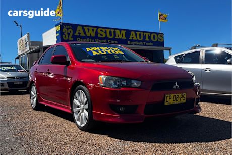 Red 2010 Mitsubishi Lancer Sedan Vr-X