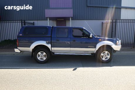 Blue 2009 Nissan Navara Dual Cab Pick-up St-R (4X4)