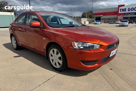 Orange 2012 Mitsubishi Lancer Sedan Es