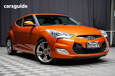 Orange 2014 Hyundai Veloster Coupe +