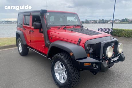 Red 2013 Jeep Wrangler Softtop Unlimited Sport (4X4)