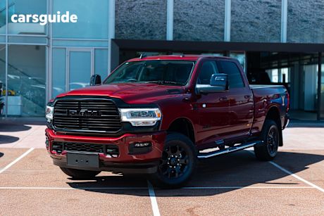 Red 2024 RAM 2500 Crew Cab Utility Laramie Yellowstone