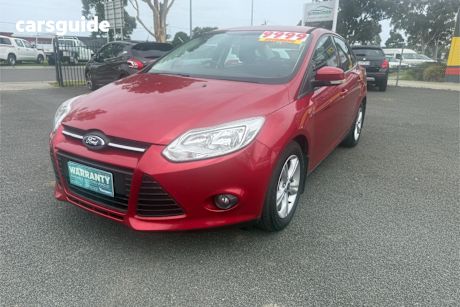 Red 2014 Ford Focus Sedan Trend