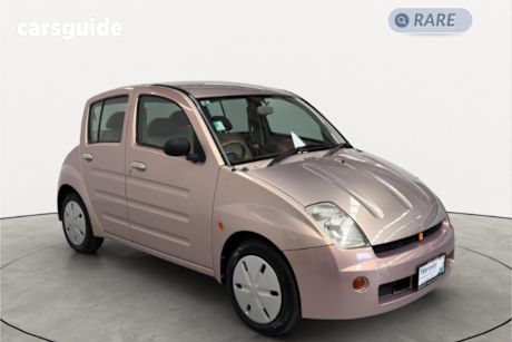 Pink 2000 Toyota Will Sedan VI