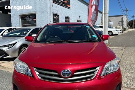 Red 2010 Toyota Corolla Sedan Ascent