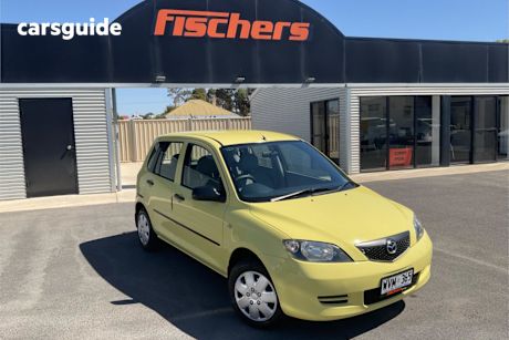 Yellow 2002 Mazda 2 Hatchback Neo