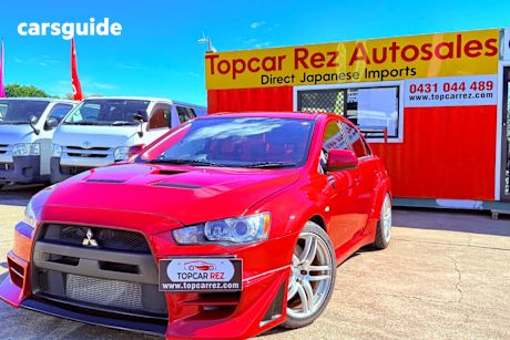 Red 2007 Mitsubishi Lancer Sedan Evolution X