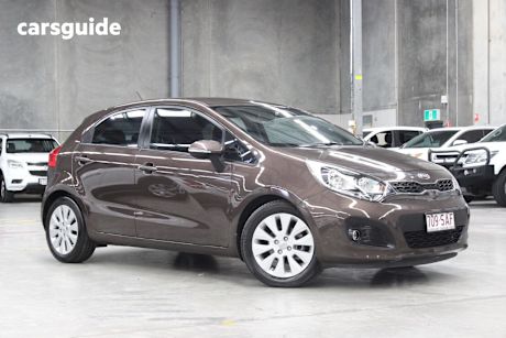 Brown 2011 Kia RIO Hatchback Si