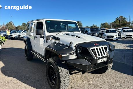 White 2019 Jeep Wrangler Unlimited Softtop Sport S (4X4)
