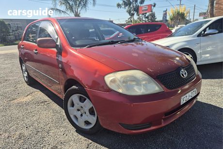 Red 2004 Toyota Corolla Hatchback Ascent Seca
