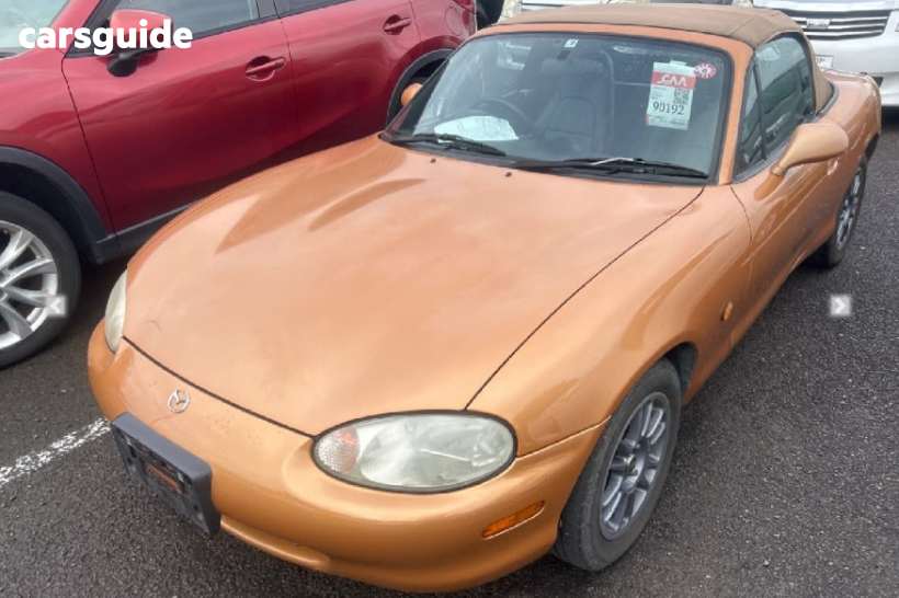 Orange 1998 Mazda MX-5 Convertible
