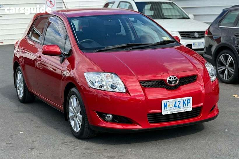 Red 2009 Toyota Corolla Hatchback Conquest