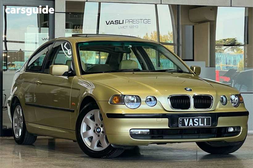 Yellow 2004 BMW 318TI Hatchback