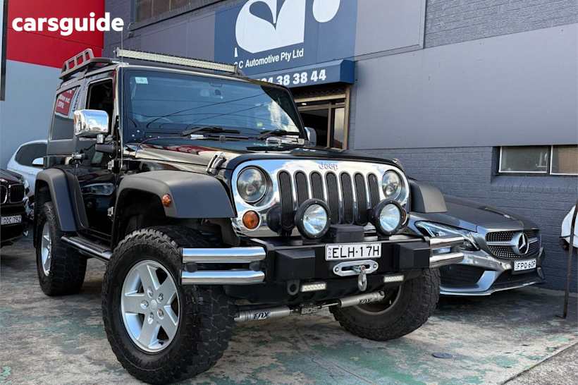 Black 2012 Jeep Wrangler Softtop Sport (4X4)