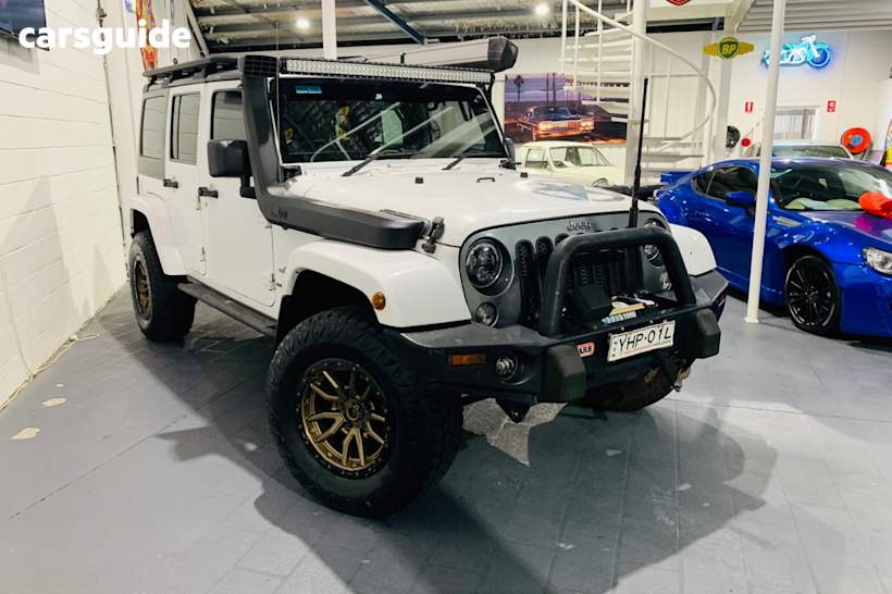 White 2014 Jeep Wrangler Unlimited Softtop Freedom (4X4)
